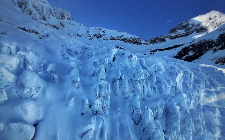 A glacier below Mount Assiniboine seen from a helicopter
