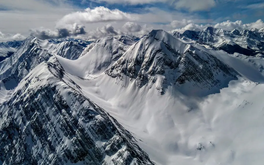 The Three Sisters peaks above Canmore seen from the air