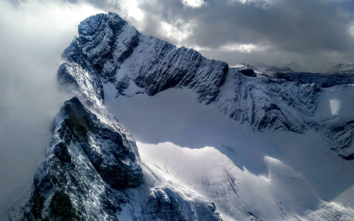 The Three Sisters peaks above Canmore seen from the air