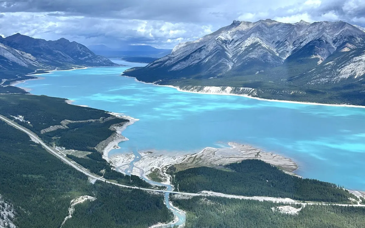 A turquoise glacial lake in the Canadian Rockies from the air